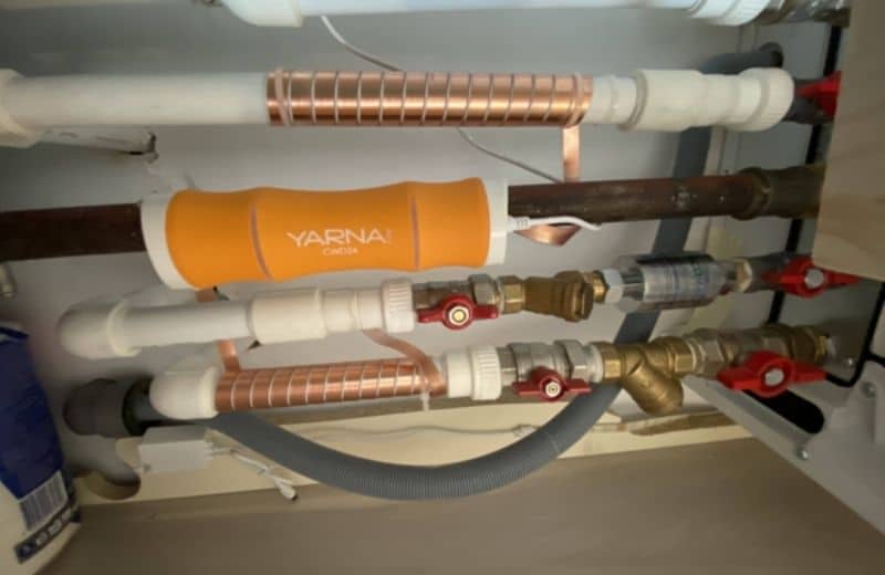 Yarna electronic water descaler in basement