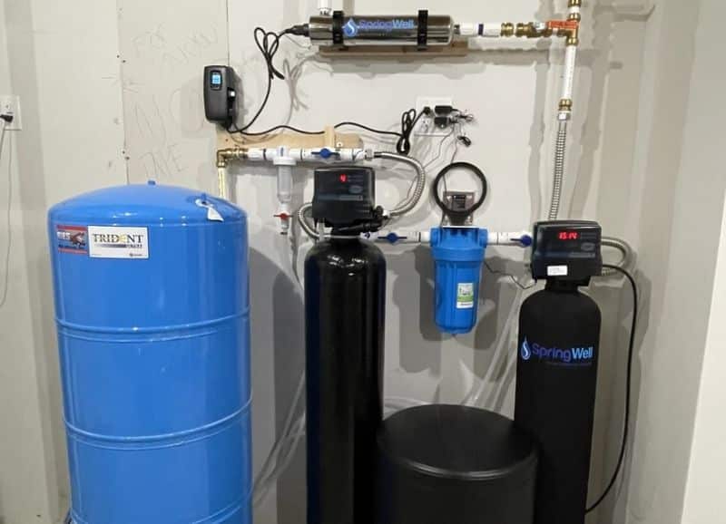 Well water treatment systems with UV purification