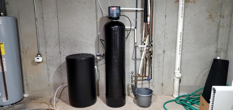 Salt-based water softener system in basement