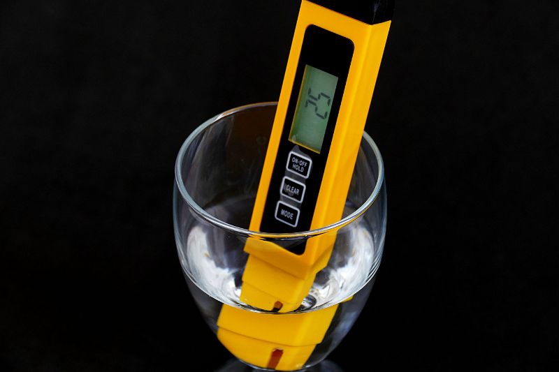 Tds meter in a glass of water