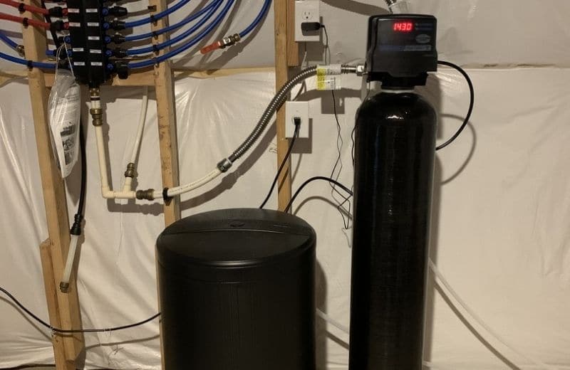 Ion exchange water softener in basement