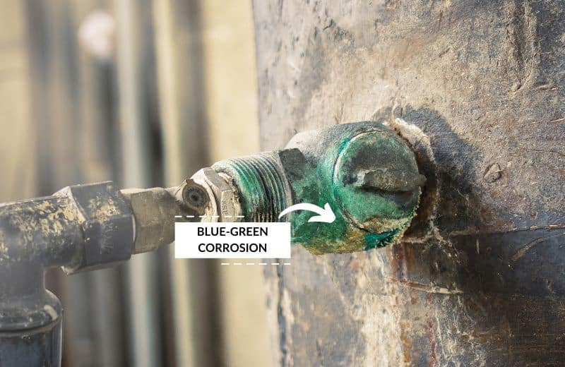 Blue-green stains on plumbing fixture caused by copper corrosion