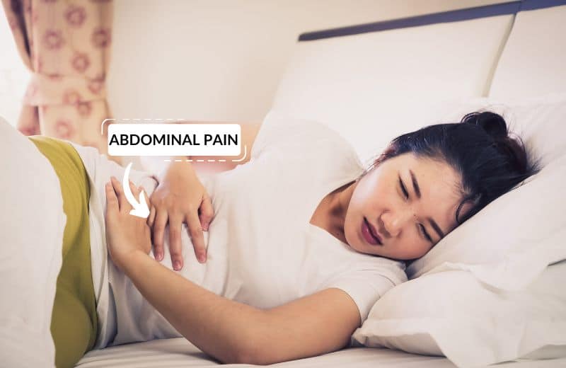 Woman suffering from abdominal pain