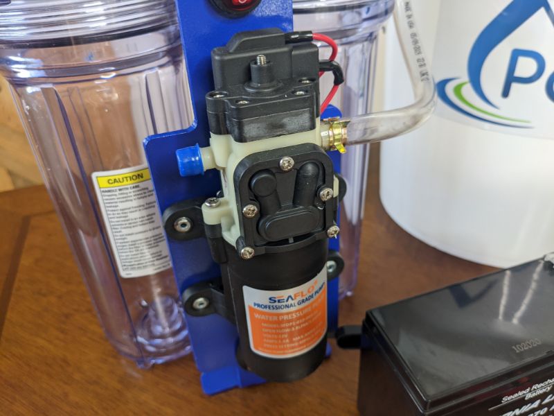 Integrated pump on portawell water filter system