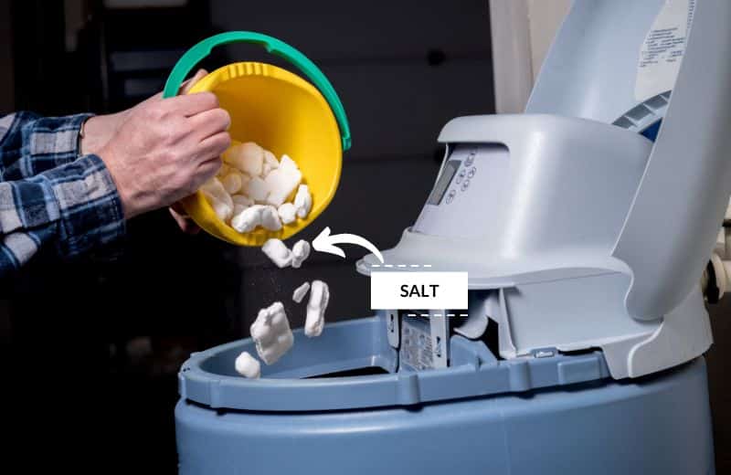 adding salt to a water softener brine tank