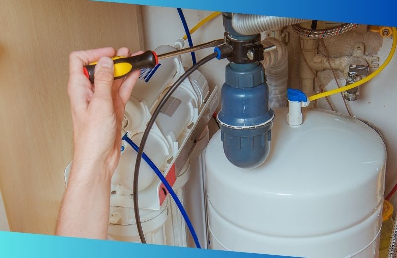 Tightening a loose plumbing connection on under sink water filtration system