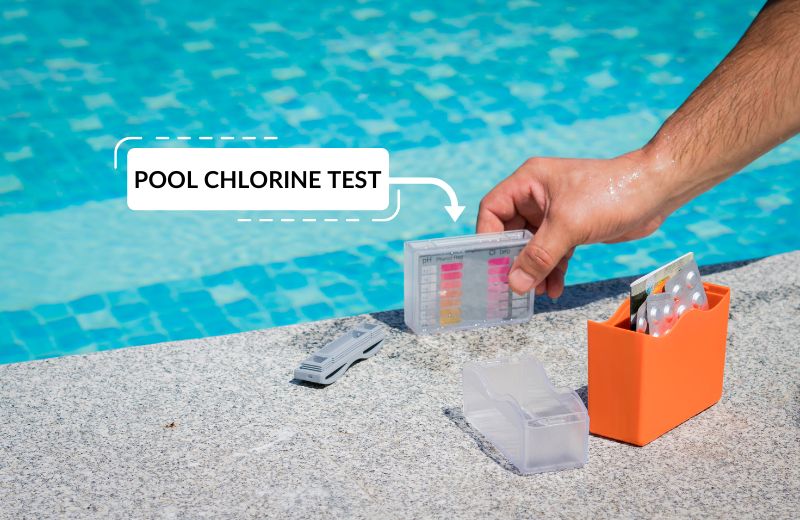 Testing chlorine and pH levels of well water in pool