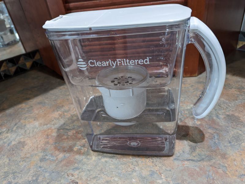 https://waterfilterguru.com/wp-content/uploads/2022/08/Clearly-Filtered-water-pitcher-on-countertop.jpg