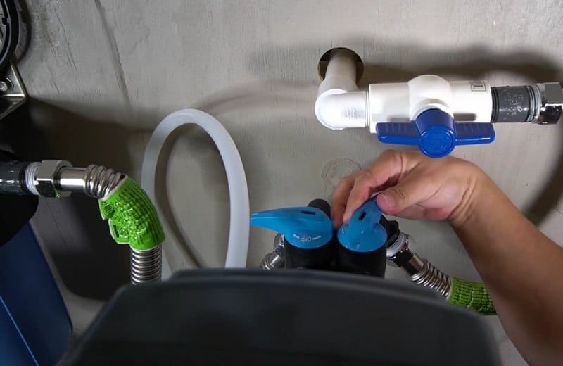 Engaging the bypass valve of a water softener