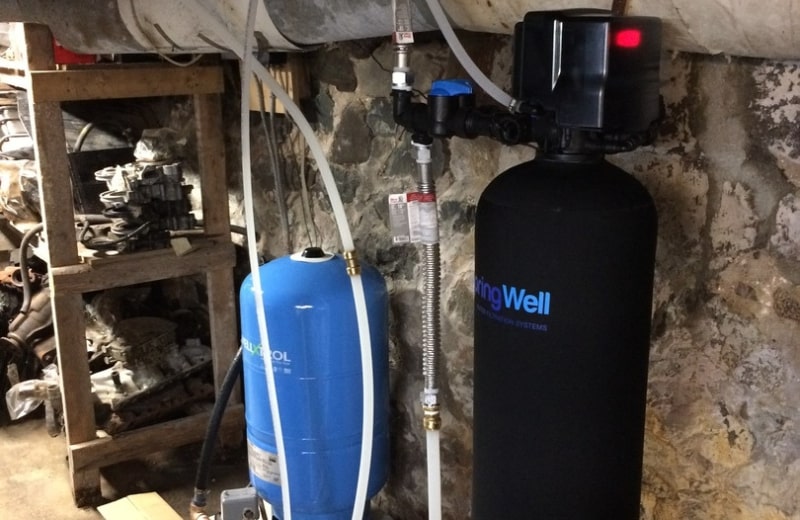 Water softener installed in home's point of entry downstream of the well pressure tank