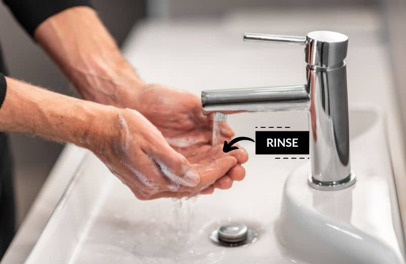 rinsing hands in sink