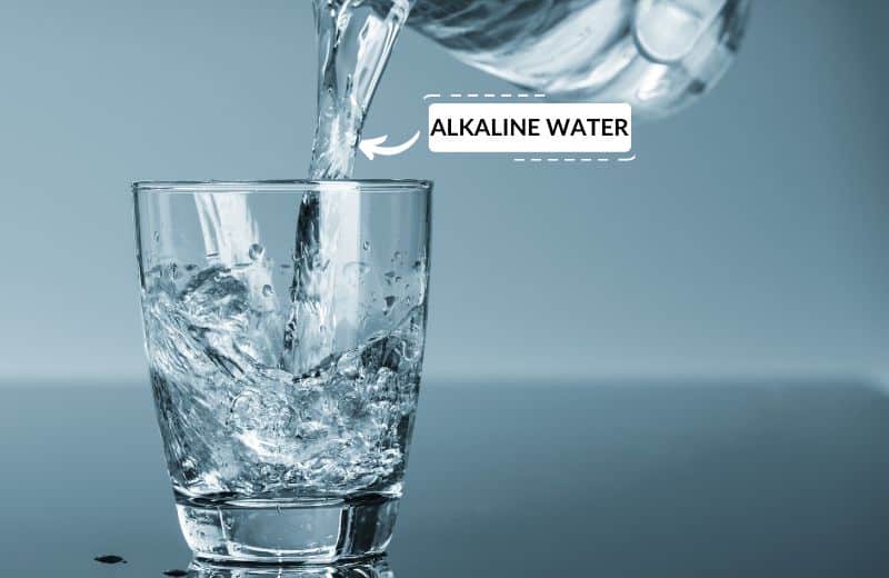 Pouring alkaline water into a glass