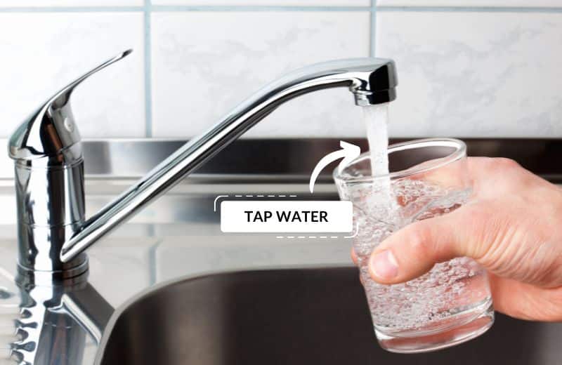 Filling a glass with tap water