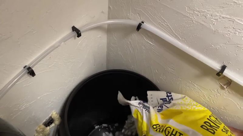 Adding salt to water softener brine tank