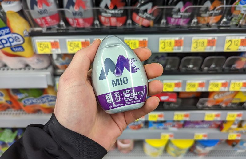 Hand holding a Mio water enhancer