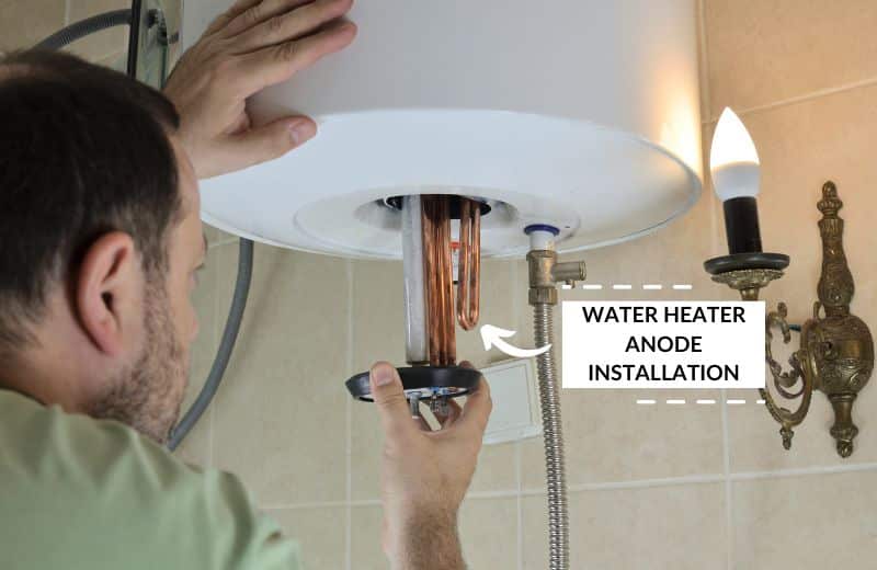 Man installing new water heater anode