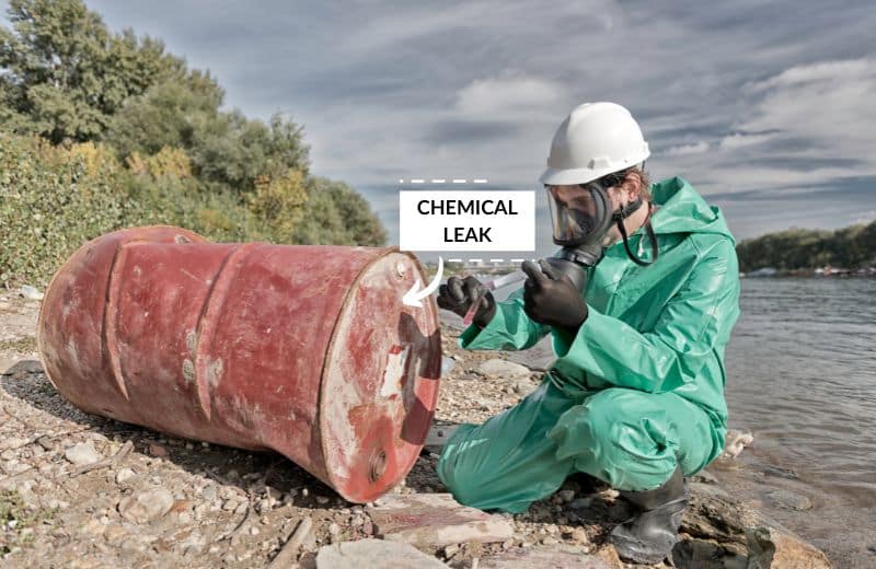 Taking a sample from a chemical leak near a river