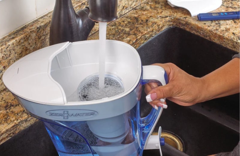 Filtering water with ZeroWater pitcher to remove pfas from water