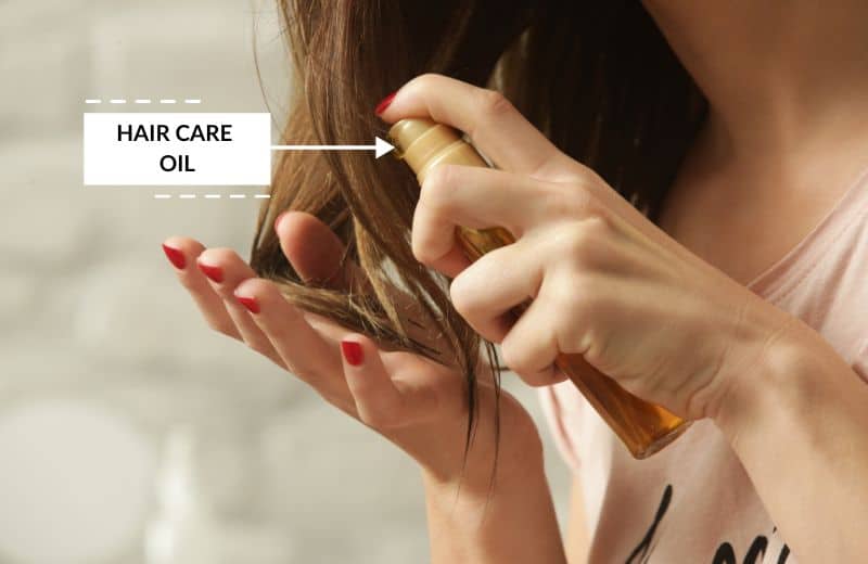 Applying hair care oil on hair