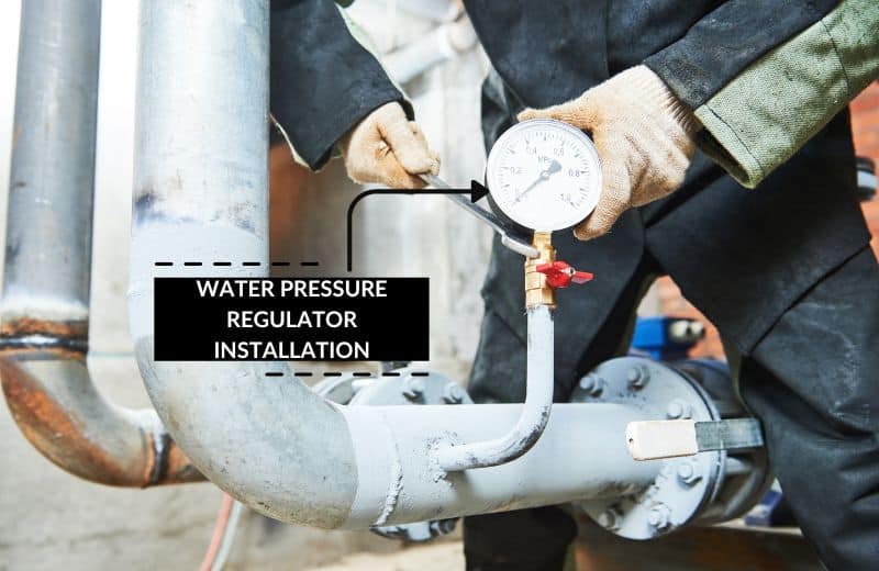 Plumber installing a water pressure regulator