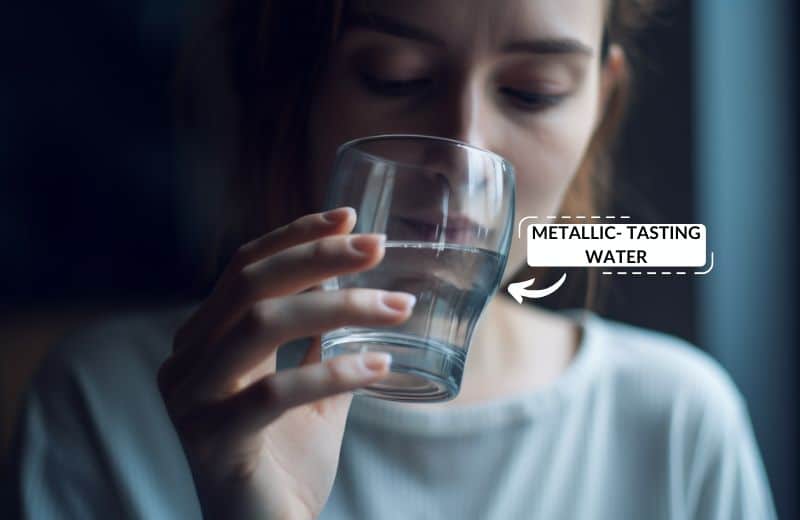 Woman drinking metallic-tasting water