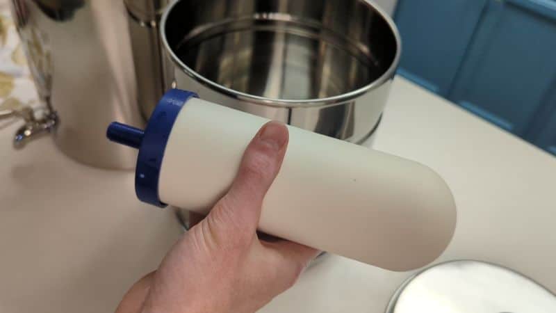 Holding ceramic water filter