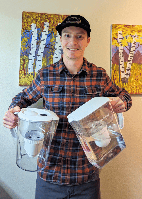 Brian holding two water filter pitchers