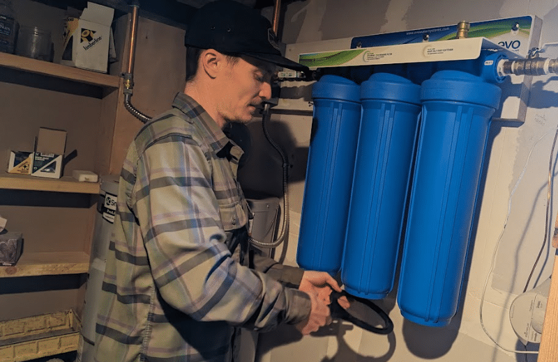 Brian removing the filter housing of Kind E-1000 Whole House Filter