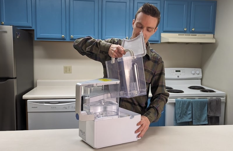 Brian removing the water tank of AquaTru Countertop RO System