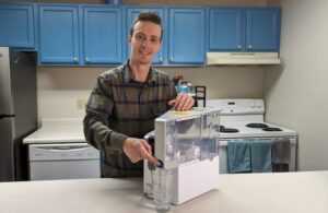Brian getting filtered water from Aquatru