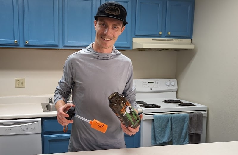 Brian holding the Epic Nalgene OG bottle and filter cartridge