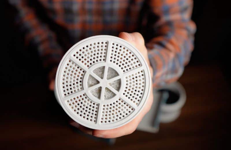 Tubo bath filter material Hand holding the tubo bath filter media upclose