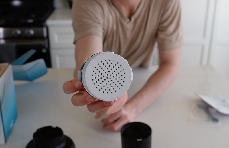 Aquatru Shower Filter Material AquaTru shower filter cartridge front view showing perforated face for water filtration