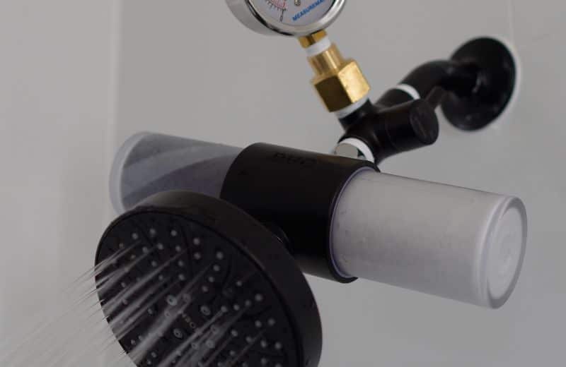 Weddell Duo Shower Filter Design Weddell Duo shower filter installed on showerhead with pressure gauge, showing dual-stage filtration system in use.