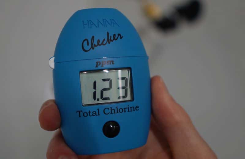 Hello Klean Chlorine Content Digital chlorine tester showing 1.23 PPM total chlorine after filtration with the Hello Klean shower filter during performance testing.