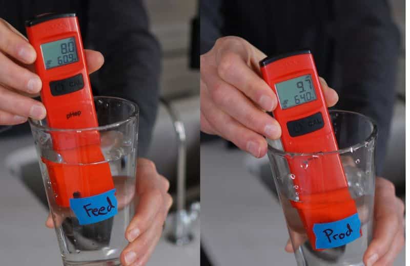 Aquasana SmartFlow pH 2 Two side‑by‑side photos show a red digital pH meter labeled “pHep” measuring water samples from Aquasana Smartflow RO. On the left, the meter is in a glass labeled “Feed,” displaying pH 8.0 and 60.9°F. On the right, the meter is in a glass labeled “Prod,” displaying pH 9.7 and 64.0°F.