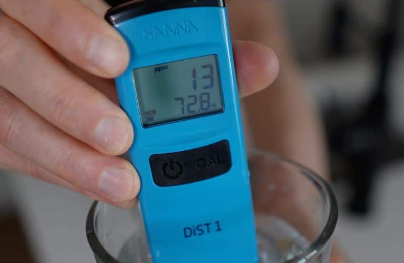 AquaTru Under Sink 2nd Gen TDS 2nd reading A digital water tester displays 13 ppm, showing improved water purity after filtration with the Aquatru Under Sink RO 2nd gen system.