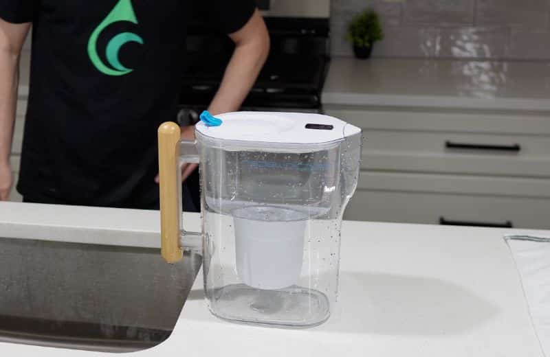 Epic Pure XP Design A clear water filter pitcher sits on a kitchen countertop as shown in an Epic Pure XP review.